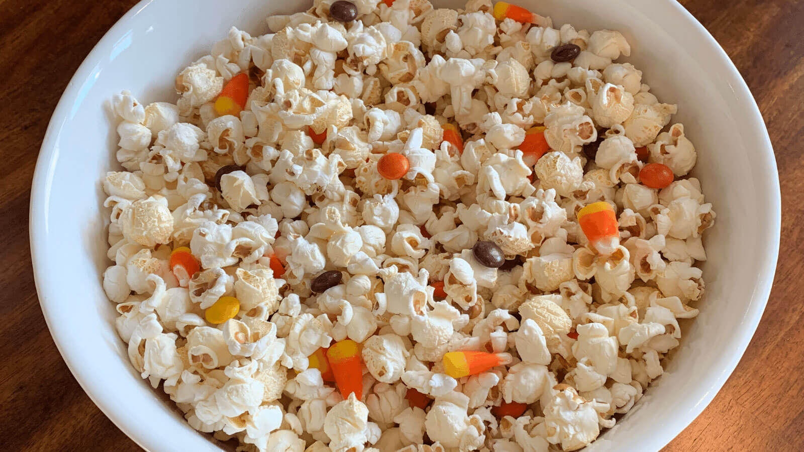 Bowl of popcorn with candy.
